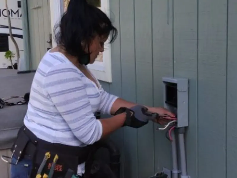 Licensed electrician wiring an exterior subpanel in Bemidji